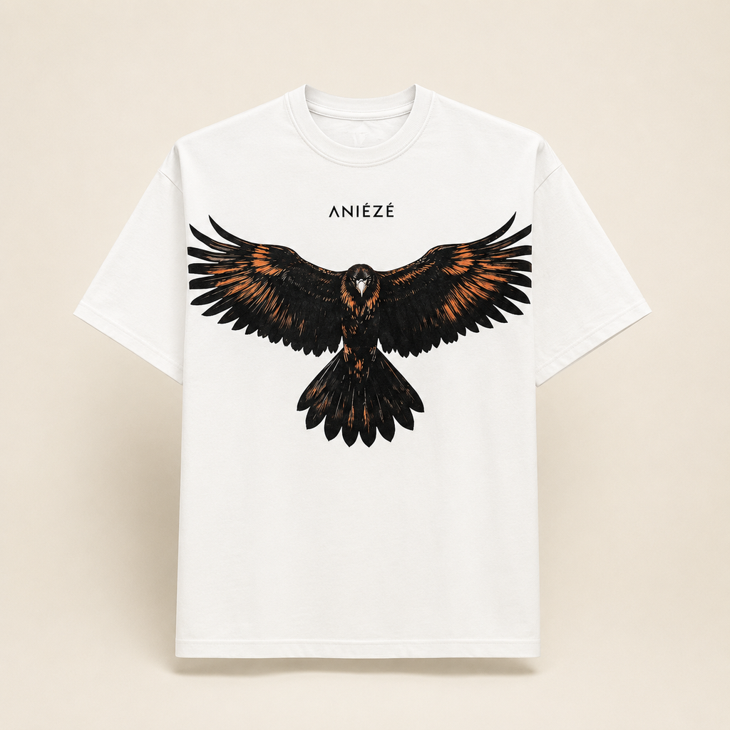 ANIÉZÉ Ascension Tee in Pearl Ivory, front view with black and copper eagle artwork